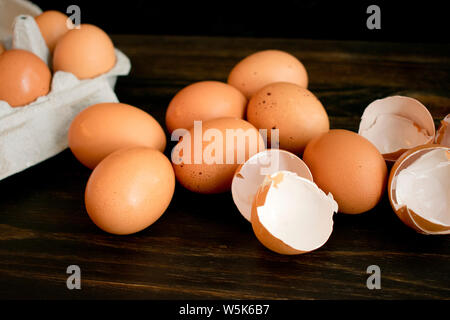 Brown Eggs and Eggshells on a Wood Table Stock Photo