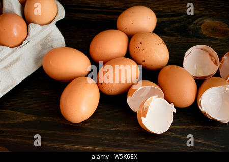 Brown Eggs and Eggshells on a Wood Table Stock Photo