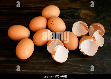 Brown Eggs and Eggshells on a Wood Table Stock Photo