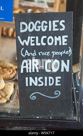 Chalkboard sign reads, "Doggies Welcome" and "Air Con inside" Stock Photo