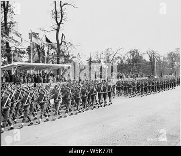 British troops pass by the reviewing stand during the British victory parade in Berlin, Germany during the Potsdam Conference. British Prime Minister Winston Churchill is in the reviewing stand. Stock Photo
