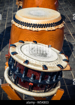 Traditional asian percussion instruments. Taiko or wadaiko or chu-daiko drum and shime-daiko or namitsuke ready for outdoor permormance Stock Photo