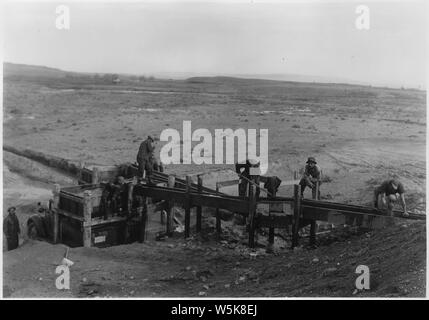 CCC Camp BR-72 Shoshone Project: Garland Division photo showing enrollees operating sand washer at Alkali Creek. R. C. Kay photographer. Stock Photo