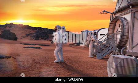 astronauts around a Mars base, research habitat on the surface of the red planet Stock Photo