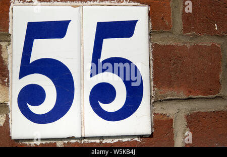 Numbers on ceramic plaques read Fifty five [55] Stock Photo