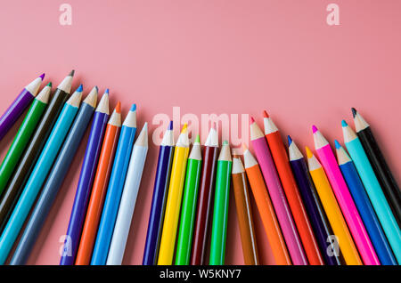 Color pencils isolated on pink background, back to school Stock Photo