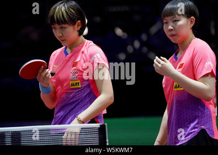 Chen Meng and Zhu Yuling of China react as they compete against Belma Busatlic and Emina Hadziahmetovic of Bosnia and Herzegovina in their first round Stock Photo