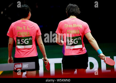 Chen Meng and Zhu Yuling of China react as they compete against Belma Busatlic and Emina Hadziahmetovic of Bosnia and Herzegovina in their first round Stock Photo