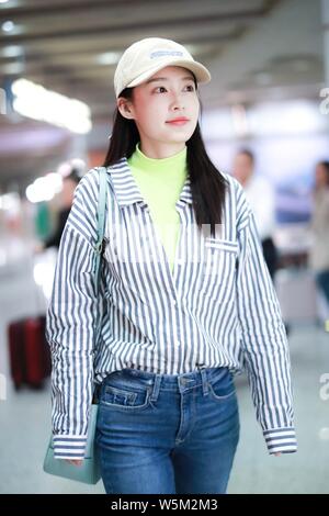 Chinese actress Li Qin arrives at the Beijing Capital International Airport in Beijing, China, 25 April 2019. Stock Photo