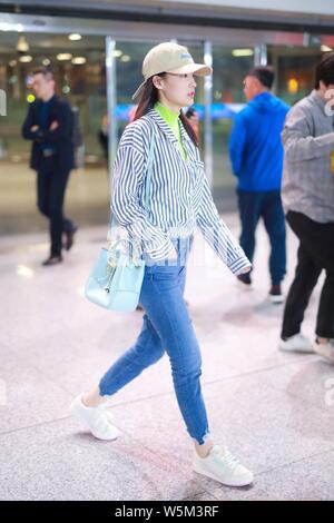 Chinese actress Li Qin arrives at the Beijing Capital International Airport in Beijing, China, 25 April 2019. Stock Photo