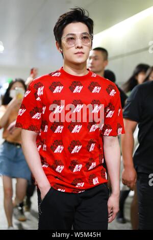 --FILE--Chinese actor Yang Yang arrives at the Shanghai Hongqiao International Airport in Shanghai, China, 23 June 2018. Stock Photo