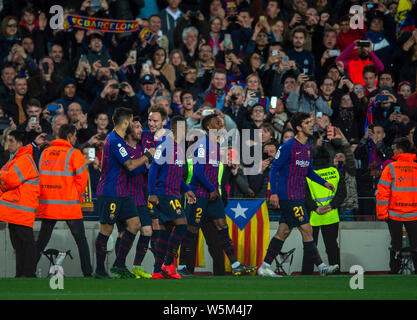 Lionel Messi, third left, of FC Barcelona celebrates with teammates after scoring Barcelona's second goal against Club Atletico de Madrid during their Stock Photo