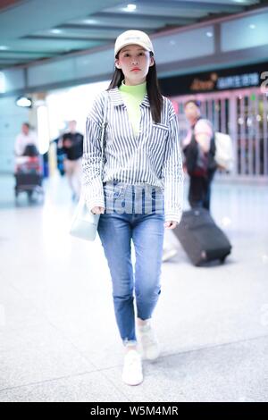 Chinese actress Li Qin arrives at the Beijing Capital International Airport in Beijing, China, 25 April 2019. Stock Photo