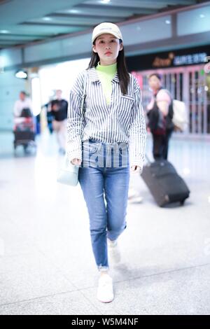 Chinese actress Li Qin arrives at the Beijing Capital International Airport in Beijing, China, 25 April 2019. Stock Photo