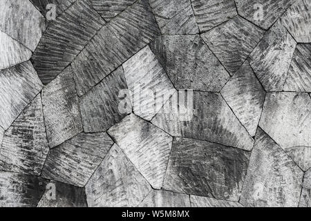 Grey stone wall background, pattern with different geometric shapes. Stock Photo