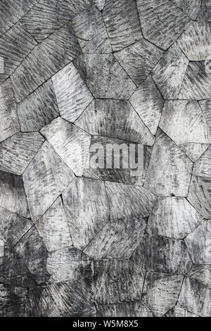 Grey stone wall background, pattern with different geometric shapes. Stock Photo
