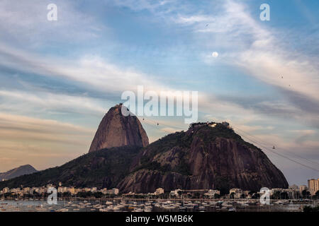 Cloudy full moon on Sugarloaf Stock Photo