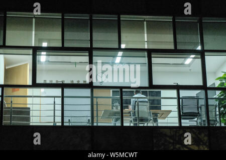 An employee works at two o'clock in the morning in the Zhongguancun Software Park in Beijing, China, 16 April 2019.   Chinese tech employees are pushi Stock Photo