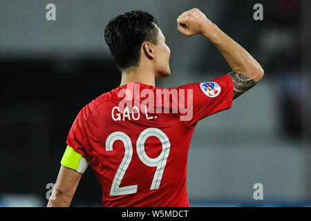 Gao Lin of China's Guangzhou Evergrande celebrates after scoring Guangzhou Evergrande's fourth goal against Australia's Melbourne Victory during their Stock Photo