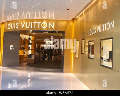 FILE--A customer shops for a handbag in the fashion boutique of Louis  Vuitton (LV) at a shopping mall in Nanjing city, east China's Jiangsu  province Stock Photo - Alamy