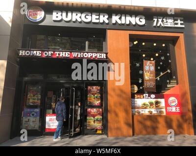 --FILE--A customer enters a fastfood restaurant of Burger King in Shanghai, China, 18 December 2018.   US fast food chain Burger King on Tuesday apolo Stock Photo