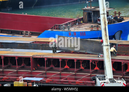 --FILE--Chinese workers manufacture a cargo ship at a factory in Yichang city, central China's Hubei province, 9 December 2018.   Orders for China's s Stock Photo