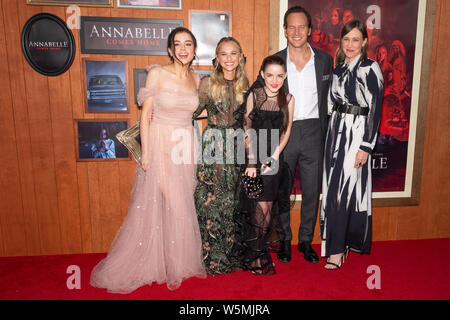 Westwood, CA - July 20, 2019: Katie Sarife wearing dress by Marmar Halim, Madison Iseman wearing dress by Giambattista Valli, Mckenna Grace, Patrick Wilson and Vera Farmiga wearing dress by Jeffrey Dodd attends premiere thriller Annabelle Comes Home at Regency Village Theatre Stock Photo