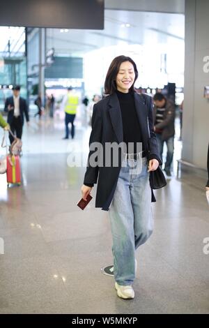 Chinese model Liu Wen arrives at a Beijing airport before departure in ...