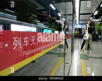 Passengers wait for their subway trains of Zhujiang New Town