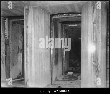 Flashlight showing downstream side of gates of sluicing tunnel.; Scope and content:  Photograph from Volume One of a series of photo albums documenting the construction of Roosevelt Dam, Stewart Dam, and other related work on the Salt River Project in Arizona. Stock Photo
