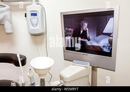 Miami Florida,Coral Gables,dentist,dentistry,dental,oral,exam,examination room,equipment,entertainment,DVD,movie,LCD screen,Clint Eastwood,movie,visit Stock Photo