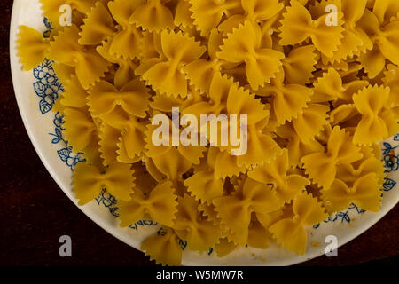 Pasta made of durum wheat in a plate. Stock Photo