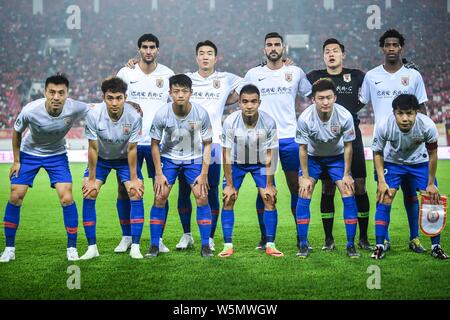 Players of the starting line-up of Shandong Luneng pose for photos before their 6th round match of the Chinese Super League 2019/2020 season against G Stock Photo