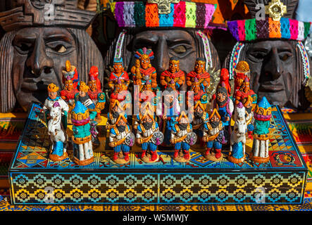 The traditional chess game board as art and craft product with Spanish against Inca on a local handicraft market in Cusco, Peru. Stock Photo