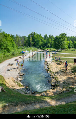 Fishing for trout at the Wolf Creek National Fish Hatchery in Kentucky on the weekend of the annual kids fishing derby Stock Photo