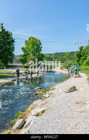 Fishing for trout at the Wolf Creek National Fish Hatchery in Kentucky on the weekend of the annual kids fishing derby Stock Photo