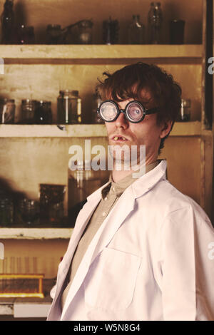Crazy scientist in his lab doing experiments Stock Photo
