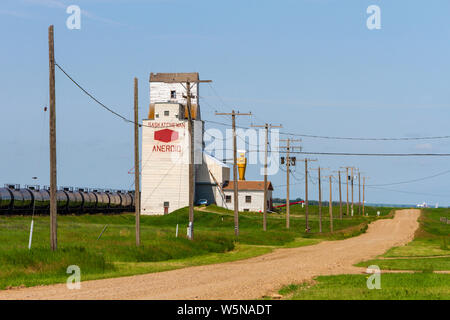 Aneroid, Saskatchewan, Canada - July 8, 2019: Landscape scenic view of old wooden grain elevator in the Canadian prairie town of Aneroid, Saskatchewan Stock Photo