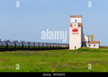 Aneroid, Saskatchewan, Canada - July 8, 2019: Landscape scenic view of old wooden grain elevator in the Canadian prairie town of Aneroid, Saskatchewan Stock Photo