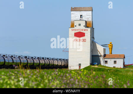 Aneroid, Saskatchewan, Canada - July 8, 2019: Landscape scenic view of old wooden grain elevator in the Canadian prairie town of Aneroid, Saskatchewan Stock Photo