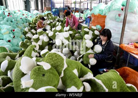 --FILE--Female Chinese workers make soft toys to be exported to the United States and Europe at a factory in Lianyungang city, east China's Jiangsu pr Stock Photo