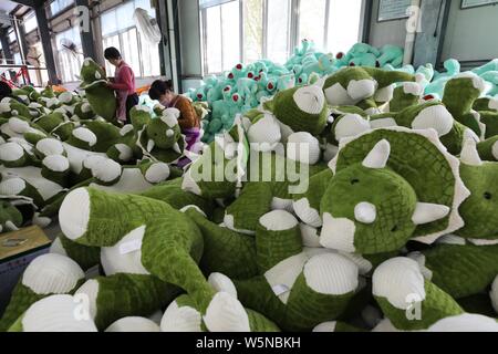 --FILE--Female Chinese workers make soft toys to be exported to the United States and Europe at a factory in Lianyungang city, east China's Jiangsu pr Stock Photo