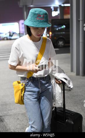 Chinese singer and actress Victoria Song or Song Qian arrives at an airport in Shanghai, China, 7 April 2019. Stock Photo