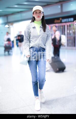 Chinese actress Li Qin arrives at the Beijing Capital International Airport in Beijing, China, 25 April 2019. Stock Photo