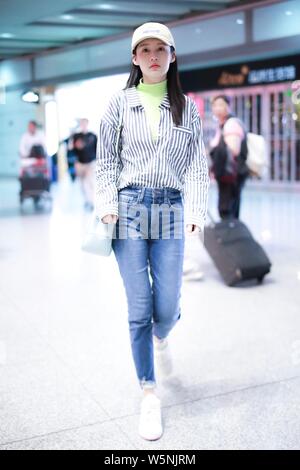 Chinese actress Li Qin arrives at the Beijing Capital International Airport in Beijing, China, 25 April 2019. Stock Photo