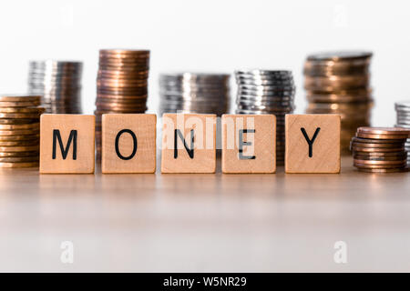 Money sign with coins in the background Stock Photo