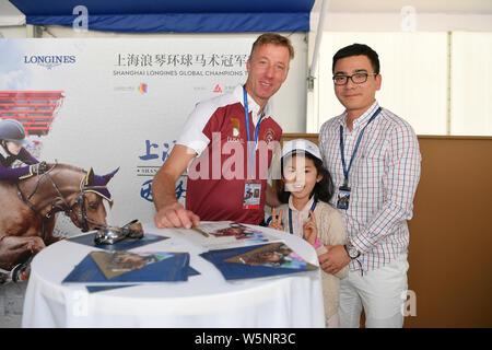 Dutch equestrian Jur Vrieling signs autographs for fans during the Shanghai Grand Prix of the 2019 Shanghai Longines Global Champions Tour in Shanghai Stock Photo