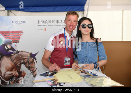 Dutch equestrian Jur Vrieling signs autographs for fans during the Shanghai Grand Prix of the 2019 Shanghai Longines Global Champions Tour in Shanghai Stock Photo