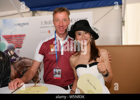 Dutch equestrian Jur Vrieling signs autographs for fans during the Shanghai Grand Prix of the 2019 Shanghai Longines Global Champions Tour in Shanghai Stock Photo