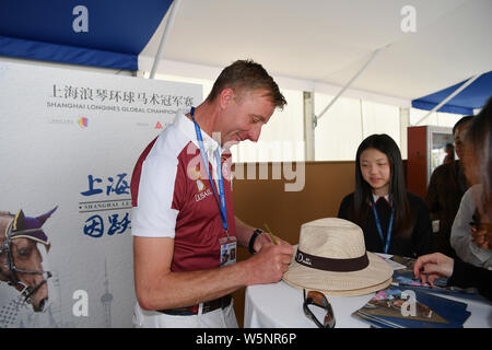 Dutch equestrian Jur Vrieling signs autographs for fans during the Shanghai Grand Prix of the 2019 Shanghai Longines Global Champions Tour in Shanghai Stock Photo